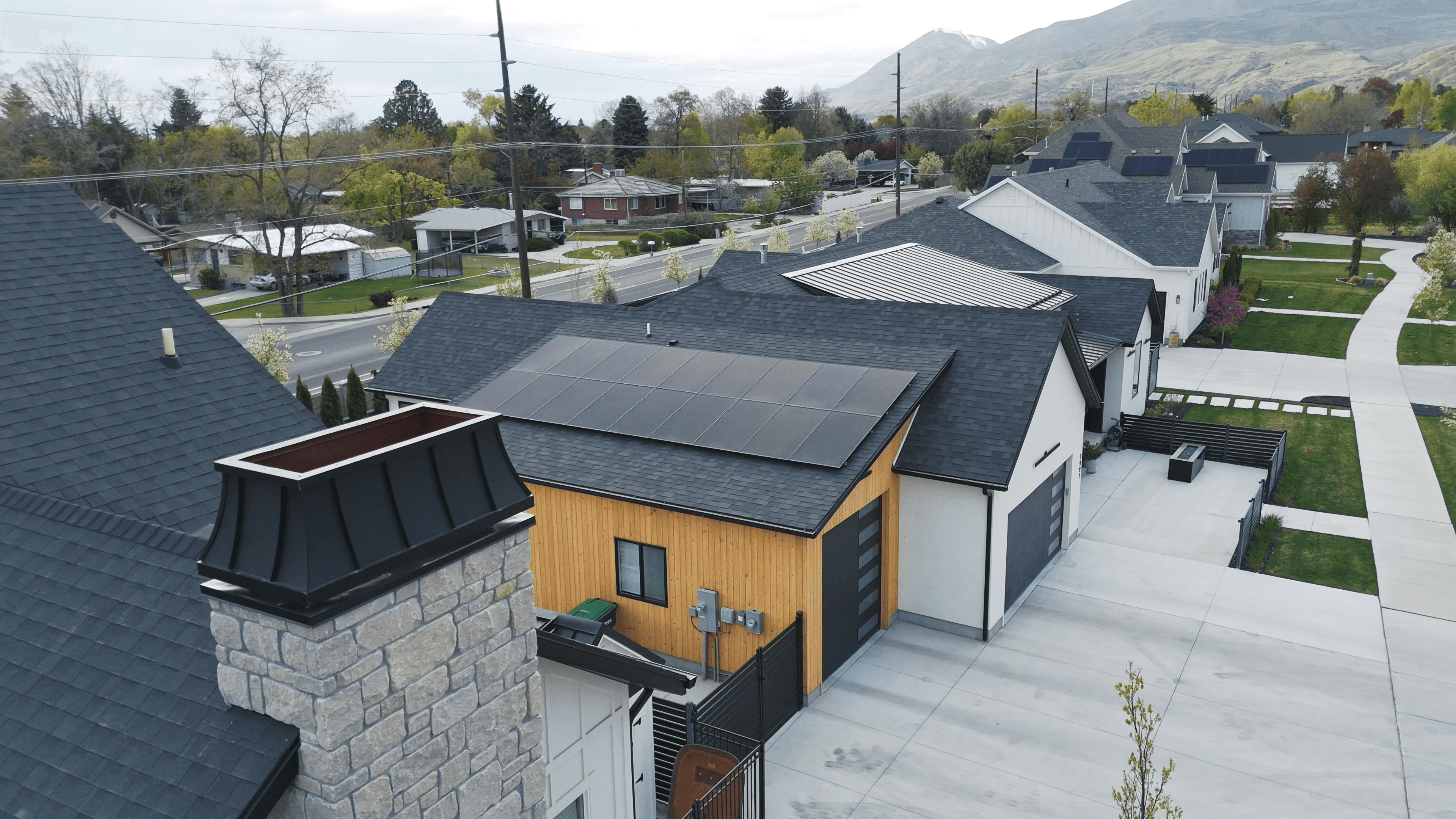 Aerial view of homes with rooftop solar panels